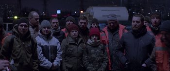 Movie still from “Loveless” (2017), directed by Andrey Zvyagintsev – A group of people standing next to each other; Medium shot, Low angle
