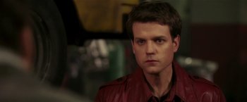 Movie still from “Lucky Number Slevin” (2006), directed by Paul McGuigan – A person wearing a red leather jacket; Close Up shot, Over the shoulder angle