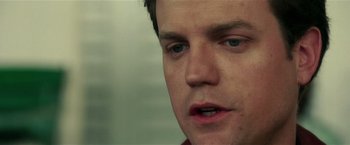 Movie still from “Lucky Number Slevin” (2006), directed by Paul McGuigan – A man's face in a room; Close Up shot, Over the shoulder angle