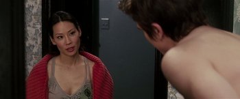 Movie still from “Lucky Number Slevin” (2006), directed by Paul McGuigan – A woman looking at a man in the mirror; Close Up shot, Over the shoulder angle