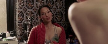 Movie still from “Lucky Number Slevin” (2006), directed by Paul McGuigan – A woman is looking at herself in the mirror; Close Up shot, Over the shoulder angle