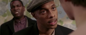 Movie still from “Lucky Number Slevin” (2006), directed by Paul McGuigan – A person wearing a hat; Close Up shot, Over the shoulder angle