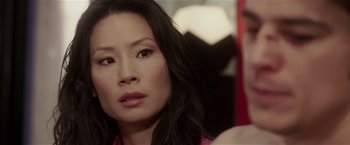 Movie still from “Lucky Number Slevin” (2006), directed by Paul McGuigan – A person with long black hair; Close Up shot, Over the shoulder angle