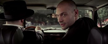 Movie still from “Lucky Number Slevin” (2006), directed by Paul McGuigan – A man sitting in the driver's seat of a car; Close Up shot, Over the shoulder angle