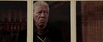 Movie still from “Lucky Number Slevin” (2006), directed by Paul McGuigan – An older man with grey hair is looking at the camera; Close Up shot, Low angle