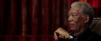 Movie still from “Lucky Number Slevin” (2006), directed by Paul McGuigan – An older man wearing a watch looking at his watch; Close Up shot, Low angle