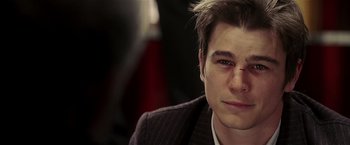 Movie still from “Lucky Number Slevin” (2006), directed by Paul McGuigan – A man with a bandage on his face; Close Up shot, Over the shoulder angle