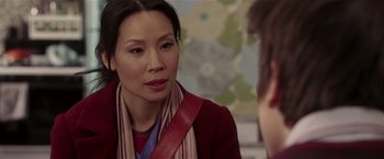 Movie still from “Lucky Number Slevin” (2006), directed by Paul McGuigan – A woman wearing a red jacket is talking to a man; Close Up shot, Over the shoulder angle