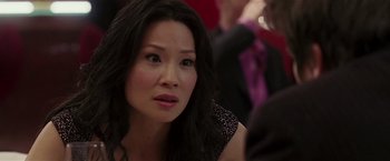 Movie still from “Lucky Number Slevin” (2006), directed by Paul McGuigan – A person with long black hair; Close Up shot, Over the shoulder angle