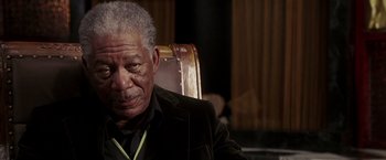 Movie still from “Lucky Number Slevin” (2006), directed by Paul McGuigan – An older man sitting in a leather chair; Close Up shot, Over the shoulder angle