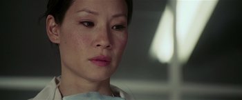 Movie still from “Lucky Number Slevin” (2006), directed by Paul McGuigan – A woman's face in a white shirt; Close Up shot, Low angle