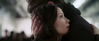 Movie still from “Lucky Number Slevin” (2006), directed by Paul McGuigan – A person with their hand on the ear of another person; Close Up shot, Over the shoulder angle