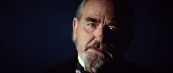 Movie still from “Ludwig” (1973), directed by Luchino Visconti – An older man with a beard and mustache; Close Up shot, Low angle