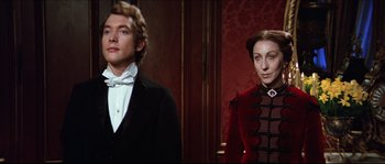 Movie still from “Ludwig” (1973), directed by Luchino Visconti – A man and a woman dressed in period clothing; Medium shot, Over the shoulder angle