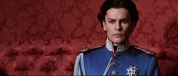 Movie still from “Ludwig” (1973), directed by Luchino Visconti – A person wearing a uniform; Close Up shot, Low angle