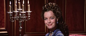 Movie still from “Ludwig” (1973), directed by Luchino Visconti – A person wearing a dress; Close Up shot, Low angle