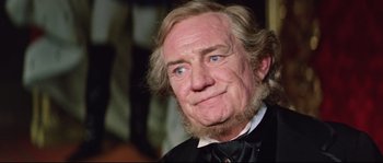 Movie still from “Ludwig” (1973), directed by Luchino Visconti – An old man with a beard and a mustache; Close Up shot, Over the shoulder angle