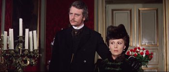 Movie still from “Ludwig” (1973), directed by Luchino Visconti – A man and a woman dressed in period clothing; Medium shot, Low angle