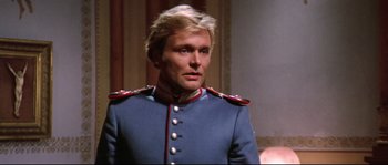 Movie still from “Ludwig” (1973), directed by Luchino Visconti – A person wearing a uniform; Close Up shot, Over the shoulder angle