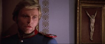 Movie still from “Ludwig” (1973), directed by Luchino Visconti – A person wearing a uniform; Close Up shot, Over the shoulder angle