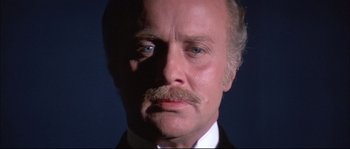 Movie still from “Ludwig” (1973), directed by Luchino Visconti – An older man with a mustache and a goatee; Close Up shot, Low angle
