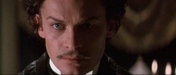 Movie still from “Ludwig” (1973), directed by Luchino Visconti – A person with a mustache; Close Up shot, Low angle