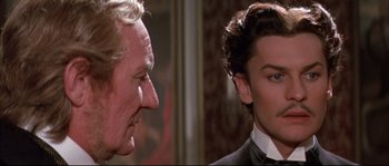 Movie still from “Ludwig” (1973), directed by Luchino Visconti – A man and a woman talking to each other; Close Up shot, Over the shoulder angle