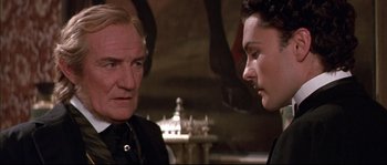 Movie still from “Ludwig” (1973), directed by Luchino Visconti – A man and a woman talking to each other; Close Up shot, Over the shoulder angle