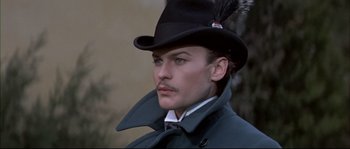 Movie still from “Ludwig” (1973), directed by Luchino Visconti – A person wearing a hat; Close Up shot, Over the shoulder angle
