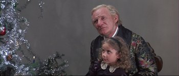 Movie still from “Ludwig” (1973), directed by Luchino Visconti – An old man and a young girl standing next to each other; Close Up shot, Low angle