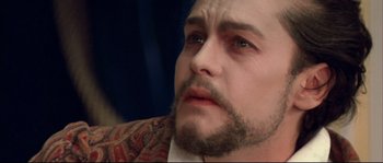 Movie still from “Ludwig” (1973), directed by Luchino Visconti – A person with a beard; Close Up shot, High angle