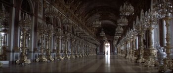 Movie still from “Ludwig” (1973), directed by Luchino Visconti – A large room with many chandeliers in it; Extreme Wide shot, High angle