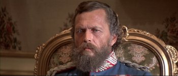 Movie still from “Ludwig” (1973), directed by Luchino Visconti – A person with a beard; Close Up shot, Low angle