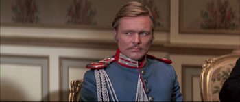 Movie still from “Ludwig” (1973), directed by Luchino Visconti – A person wearing a uniform; Close Up shot, Over the shoulder angle
