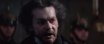 Movie still from “Ludwig” (1973), directed by Luchino Visconti – A person with a beard; Close Up shot, Over the shoulder angle