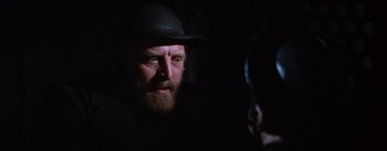 Movie still from “Lust for Life” (1956), directed by George Cukor – A man with a beard wearing a black hat; Close Up shot, Over the shoulder angle