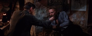 Movie still from “Lust for Life” (1956), directed by George Cukor – Two men are fighting in a barn; Medium shot, Over the shoulder angle