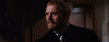 Movie still from “Lust for Life” (1956), directed by George Cukor – A person wearing a suit and tie; Close Up shot, Over the shoulder angle