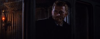 Movie still from “Lust for Life” (1956), directed by George Cukor – A person wearing a suit and tie; Close Up shot, Low angle