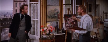 Movie still from “Lust for Life” (1956), directed by George Cukor – A person is painting flowers in a room; Medium shot, Over the shoulder angle