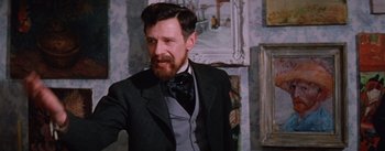 Movie still from “Lust for Life” (1956), directed by George Cukor – A man in a suit and a bow tie in front of a painting; Close Up shot, Low angle