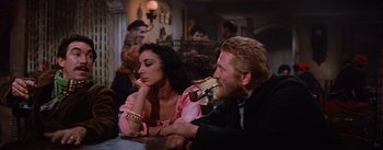 Movie still from “Lust for Life” (1956), directed by George Cukor – A man and a woman sitting at a table; Medium shot, High angle