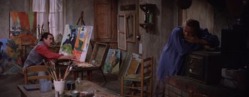 Movie still from “Lust for Life” (1956), directed by George Cukor – Many paintings on the floor of this room; Wide shot, High angle