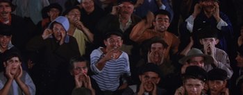 Movie still from “Lust for Life” (1956), directed by George Cukor – A group of people sitting in a room; Medium shot, High angle