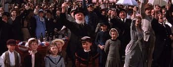 Movie still from “Lust for Life” (1956), directed by George Cukor – A group of people standing in front of each other; Medium shot, High angle