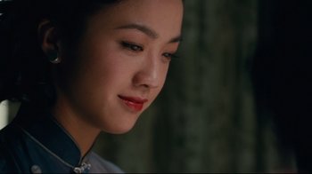 Movie still from “Lust, Caution” (2007), directed by Ang Lee – A person wearing a dress; Close Up shot, Over the shoulder angle
