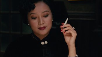 Movie still from “Lust, Caution” (2007), directed by Ang Lee – A woman holding a cigarette in her hand; Close Up shot, High angle