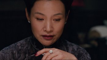 Movie still from “Lust, Caution” (2007), directed by Ang Lee – A person with a ring on their finger; Close Up shot, Over the shoulder angle