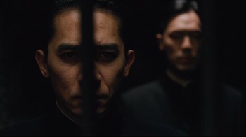 Movie still from “Lust, Caution” (2007), directed by Ang Lee – A man in a black shirt and a man in a black shirt; Close Up shot, Low angle