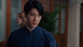 Movie still from “Lust, Caution” (2007), directed by Ang Lee – A man with a black hair and a blue shirt; Close Up shot, Over the shoulder angle
